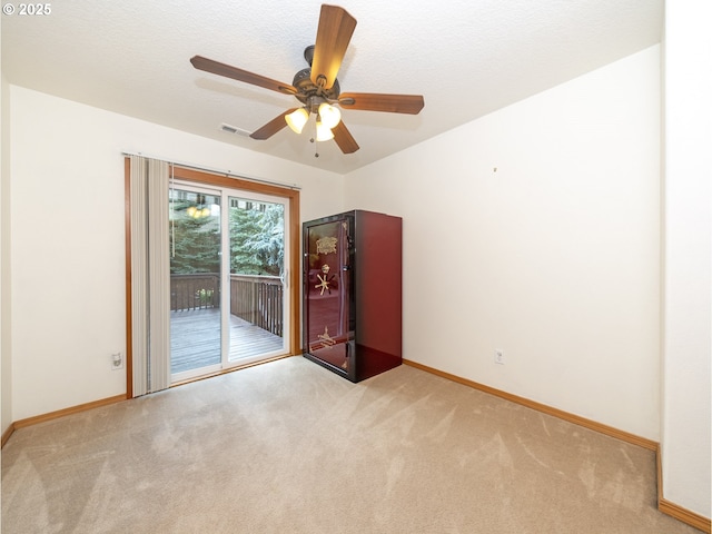 1007 4th Ave, Vernonia, OR 97064 - unfurnished room with light carpet and a ceiling fan