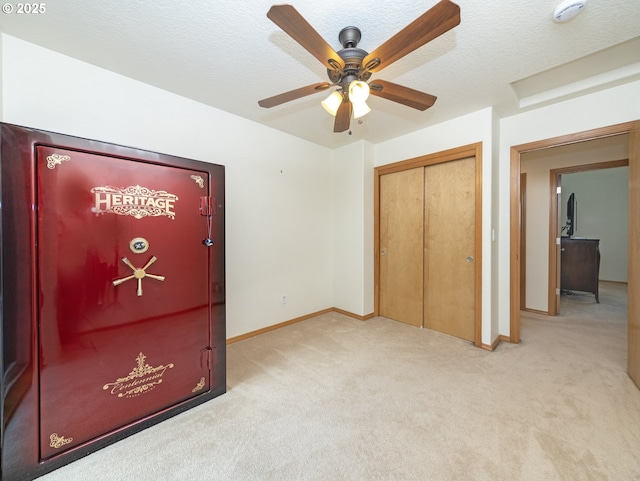 1007 4th Ave, Vernonia, OR 97064 - unfurnished bedroom with carpet, a closet, ceiling fan, and a textured ceiling
