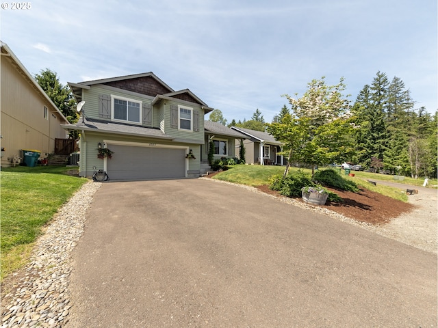 1007 4th Ave, Vernonia, OR 97064 - split level home with asphalt driveway, an attached garage, and a front lawn