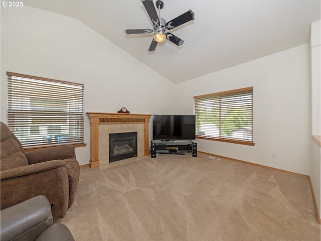 1007 4th Ave, Vernonia, OR 97064 - living area with ceiling fan, light colored carpet, a tiled fireplace, and high vaulted ceiling