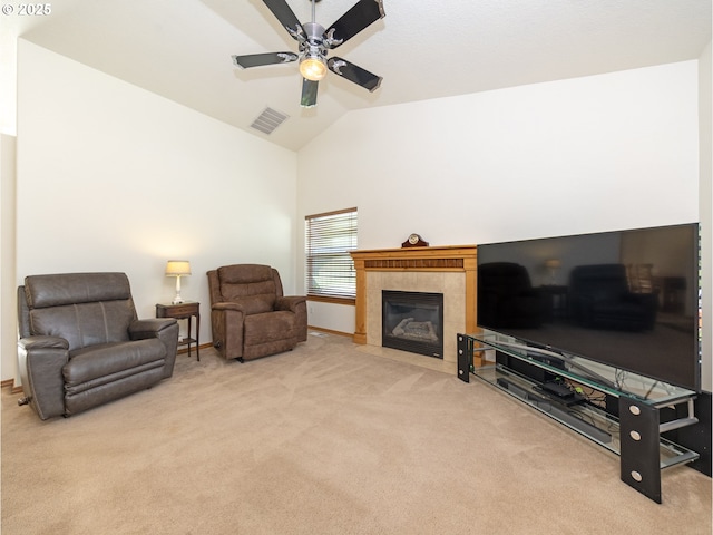 1007 4th Ave, Vernonia, OR 97064 - carpeted living room with a ceiling fan, a tiled fireplace, and high vaulted ceiling