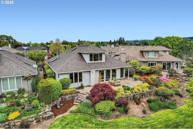 view of front of property with a patio and a residential view