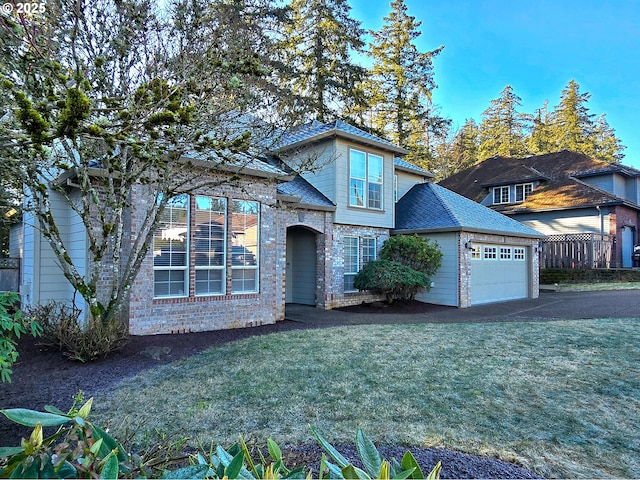 view of front facade featuring a garage and a front lawn