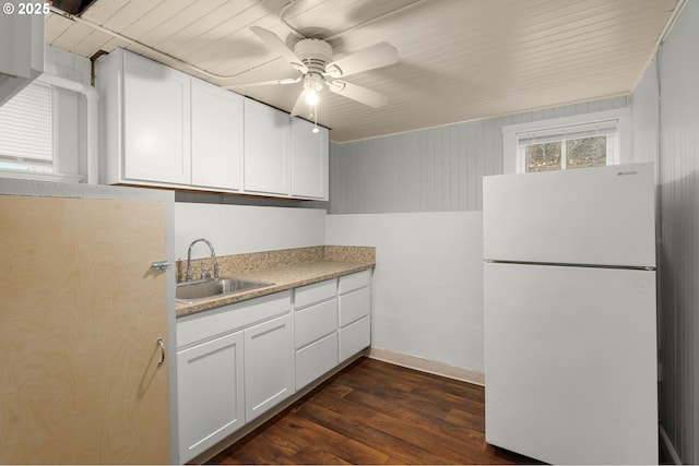 646 SE 60th Ave, Portland, OR 97215 - kitchen with white cabinets, a sink, freestanding refrigerator, a ceiling fan, and dark wood-style floors