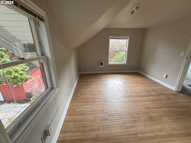 646 SE 60th Ave, Portland, OR 97215 - bonus room featuring baseboards, vaulted ceiling, and light wood-style flooring