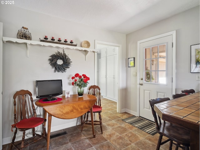 13513 SE 132nd Ave, Clackamas, OR 97015 - dining area featuring baseboards and stone finish flooring