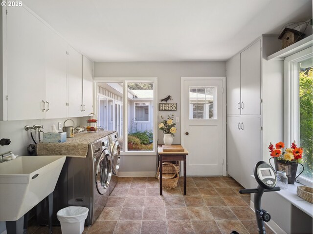 13513 SE 132nd Ave, Clackamas, OR 97015 - laundry room featuring independent washer and dryer, stone finish floors, cabinet space, and baseboards