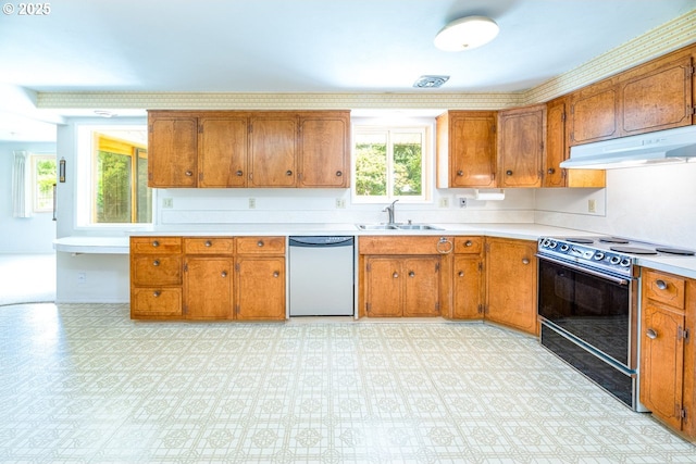 965 Robin Hood Ave, Eugene, OR 97401 - kitchen featuring dishwasher, range with electric cooktop, under cabinet range hood, brown cabinetry, and light countertops