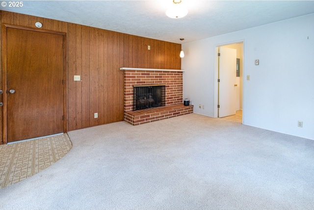 965 Robin Hood Ave, Eugene, OR 97401 - unfurnished living room with carpet, a fireplace, and wooden walls