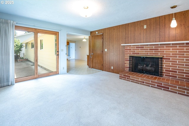 965 Robin Hood Ave, Eugene, OR 97401 - unfurnished living room with wood walls and a fireplace