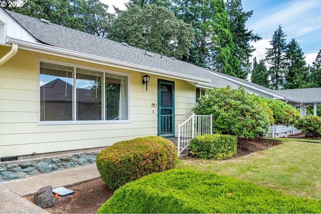 965 Robin Hood Ave, Eugene, OR 97401 - ranch-style home with a front yard, a shingled roof, and board and batten siding