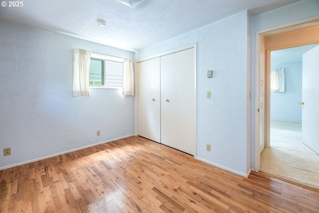 965 Robin Hood Ave, Eugene, OR 97401 - unfurnished bedroom featuring wood finished floors and a closet