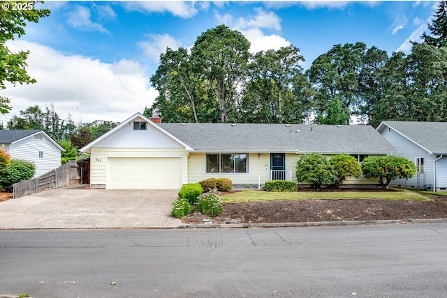 965 Robin Hood Ave, Eugene, OR 97401 - ranch-style house featuring an attached garage, driveway, and a chimney