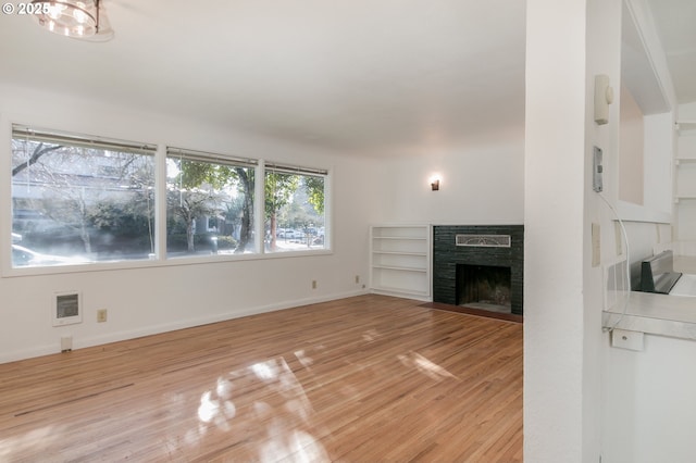 unfurnished living room with light hardwood / wood-style flooring