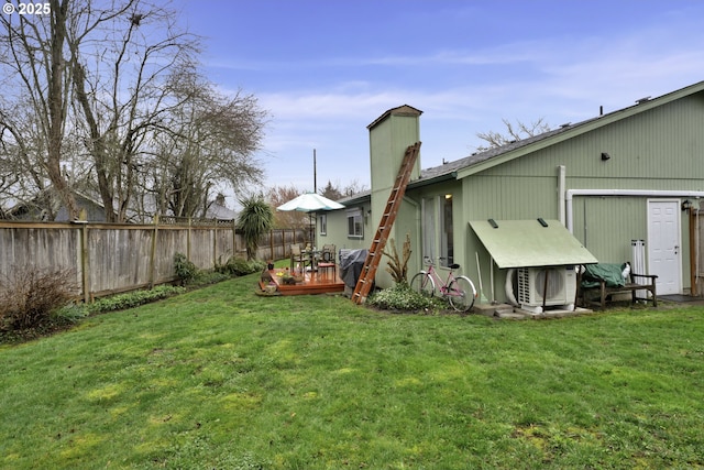 view of yard featuring a deck and fence