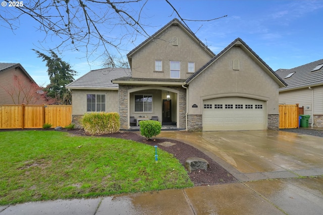 traditional-style house featuring fence, a garage, stone siding, and stucco siding