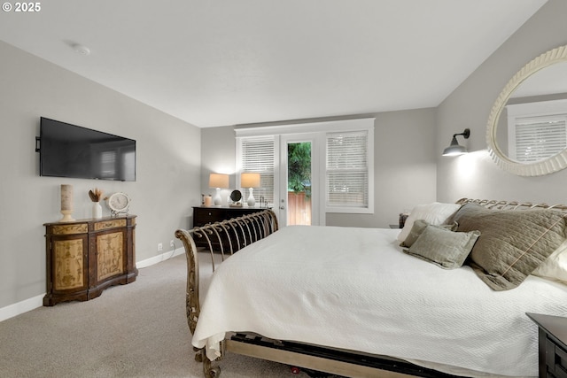 carpeted bedroom featuring baseboards