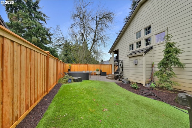 view of yard featuring a patio and a fenced backyard