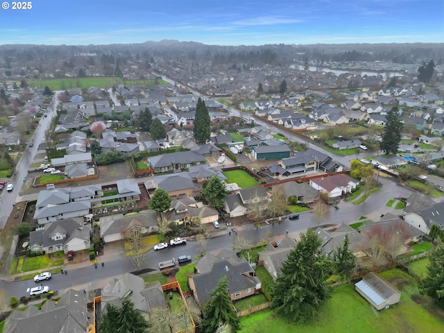 birds eye view of property with a residential view