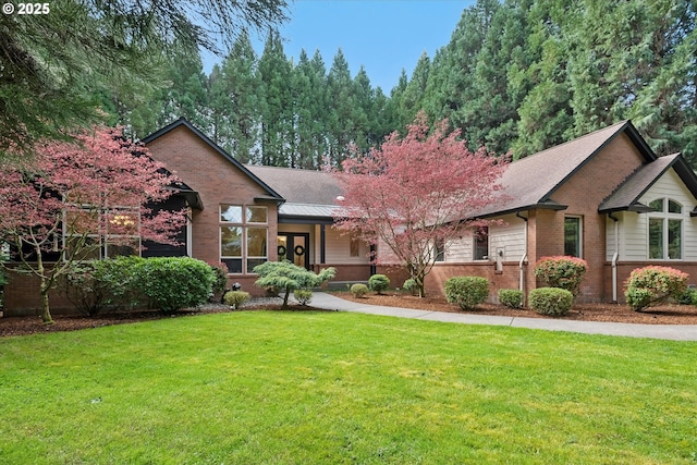 9423 NE 180th Way, Battle Ground, WA 98604 - view of front of house with brick siding and a front lawn