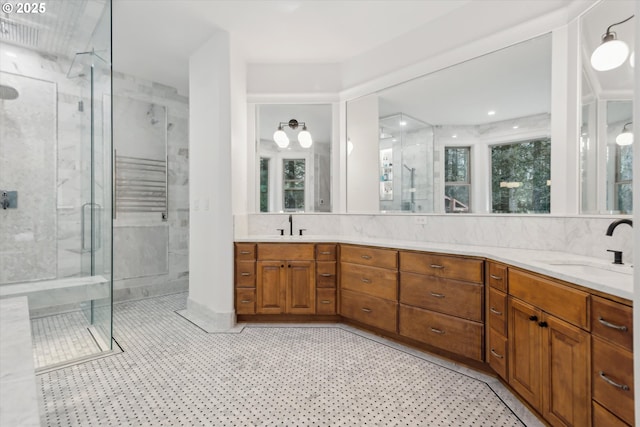 9423 NE 180th Way, Battle Ground, WA 98604 - full bathroom with a stall shower, double vanity, and decorative backsplash