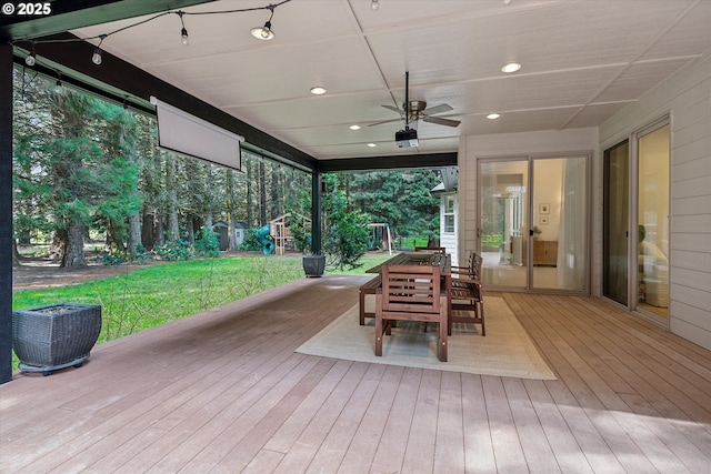 9423 NE 180th Way, Battle Ground, WA 98604 - wooden deck with a playground, a yard, outdoor dining space, and a ceiling fan