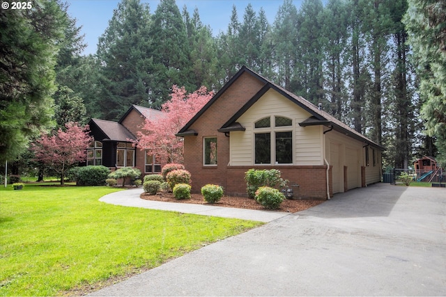 9423 NE 180th Way, Battle Ground, WA 98604 - view of front of home with brick siding, a front yard, and driveway
