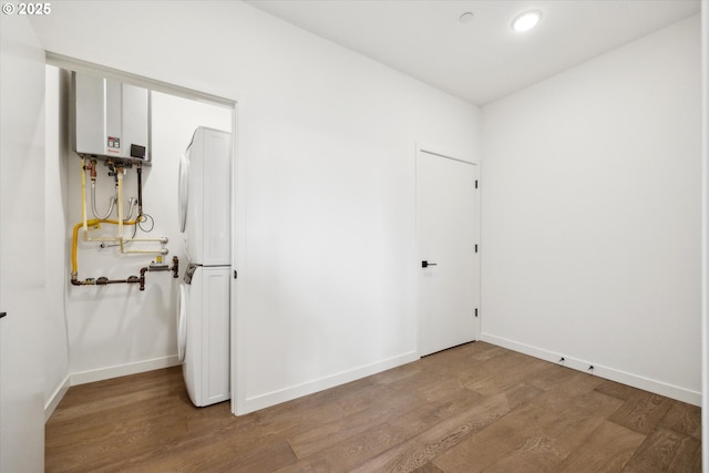 1375 N Wygant St, Portland, OR 97217 - washroom featuring wood finished floors, baseboards, water heater, and recessed lighting