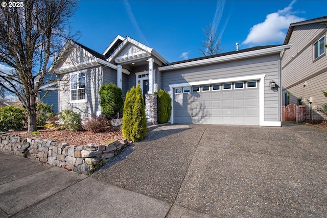 view of front of property featuring a garage and concrete driveway