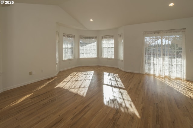 1985 32nd St, Florence, OR 97439 - unfurnished living room with baseboards, wood finished floors, and a healthy amount of sunlight