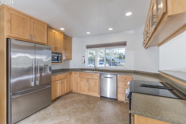 1985 32nd St, Florence, OR 97439 - kitchen featuring dark countertops, recessed lighting, a sink, and stainless steel appliances
