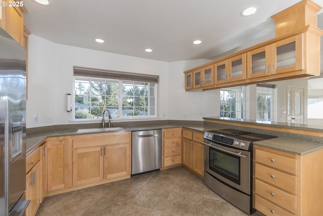 1985 32nd St, Florence, OR 97439 - kitchen featuring glass insert cabinets, a sink, appliances with stainless steel finishes, a peninsula, and recessed lighting