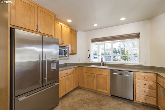 1985 32nd St, Florence, OR 97439 - kitchen featuring tile patterned flooring, recessed lighting, dark countertops, a sink, and stainless steel appliances