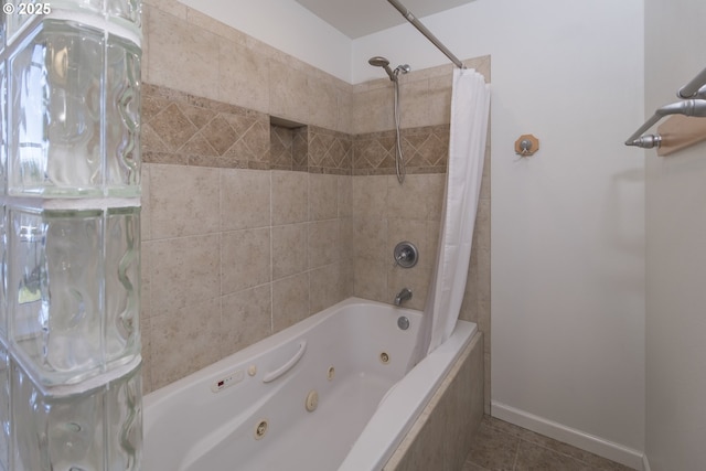 1985 32nd St, Florence, OR 97439 - full bath with a combined bath / shower with jetted tub, baseboards, and tile patterned flooring