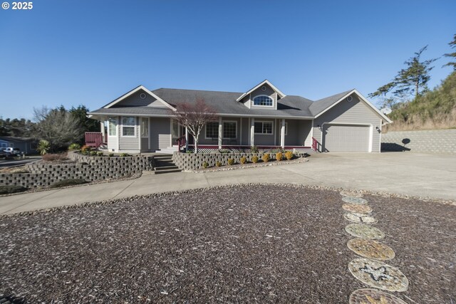 1985 32nd St, Florence, OR 97439 - view of front of home featuring a porch, driveway, and an attached garage