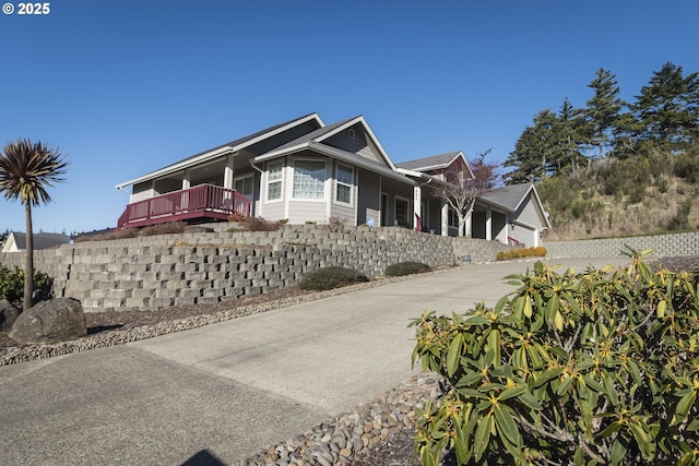 1985 32nd St, Florence, OR 97439 - view of property exterior featuring concrete driveway