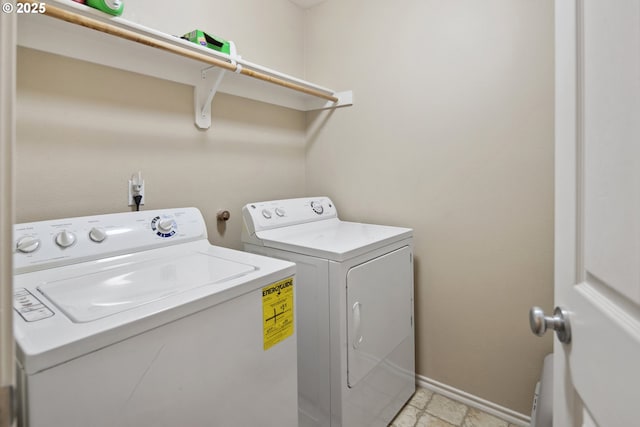 clothes washing area featuring washing machine and clothes dryer