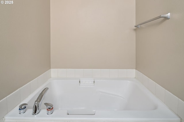 bathroom with tiled tub