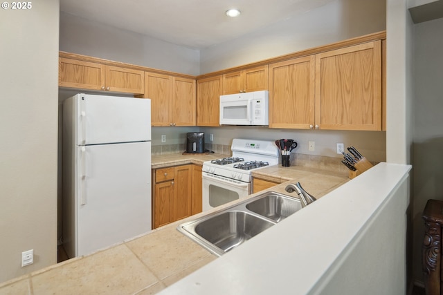 kitchen with white appliances and sink