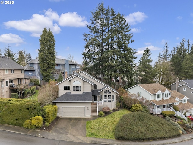 view of front of home featuring a garage, a residential view, driveway, and roof with shingles