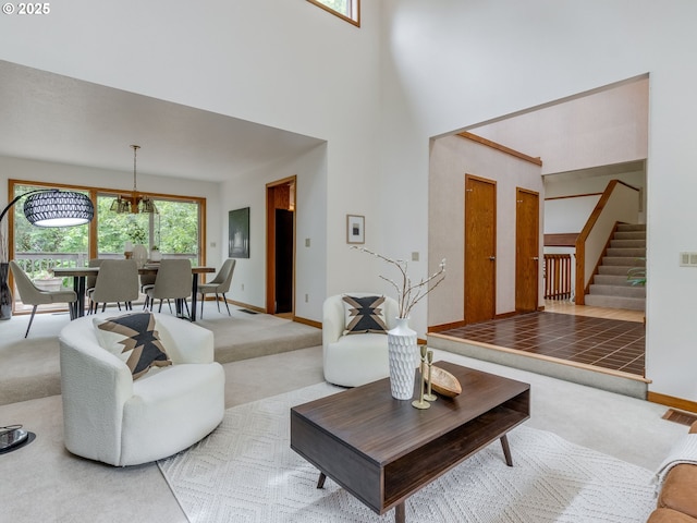 2972 Tolkien Ln, Lake Oswego, OR 97034 - carpeted living room featuring stairway, a high ceiling, and baseboards