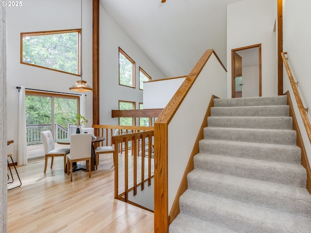 2972 Tolkien Ln, Lake Oswego, OR 97034 - staircase featuring high vaulted ceiling, healthy amount of natural light, and wood finished floors