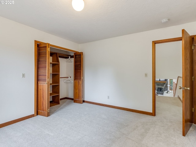 2972 Tolkien Ln, Lake Oswego, OR 97034 - unfurnished bedroom featuring light carpet, baseboards, and a closet