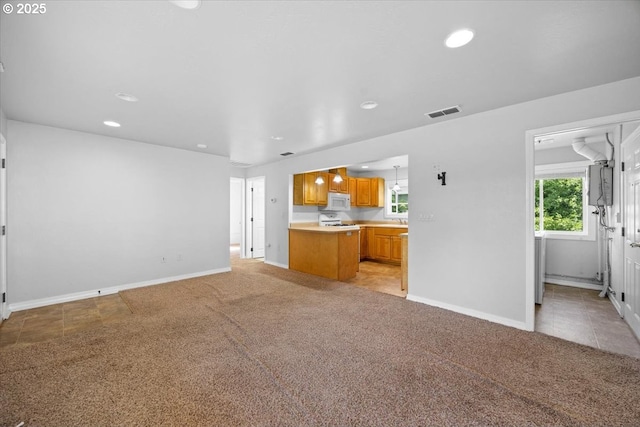 unfurnished living room featuring visible vents, recessed lighting, baseboards, and light carpet