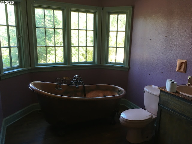 325 River Rd, Eugene, OR 97404 - full bath featuring vanity, a freestanding bath, and toilet