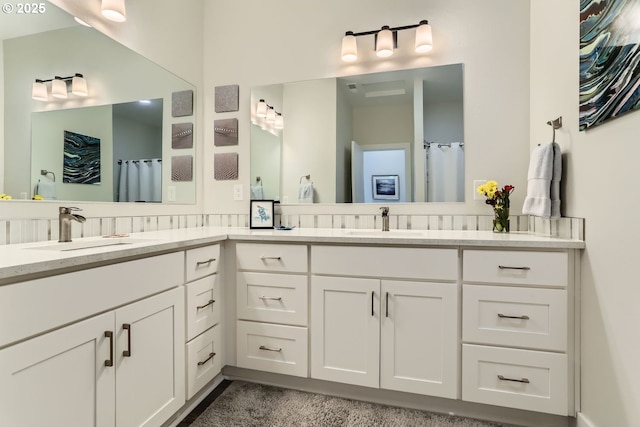 bathroom with vanity and curtained shower