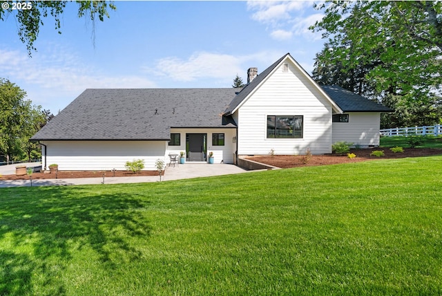 back of house featuring a patio and a chimney