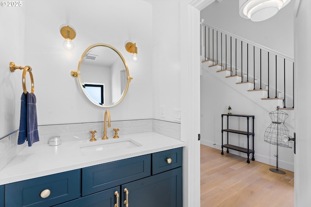 bathroom featuring wood finished floors and vanity