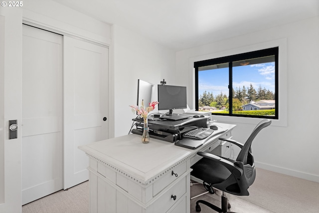 office with light colored carpet and baseboards