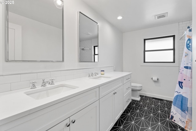 full bath featuring toilet, double vanity, baseboards, and a shower with shower curtain